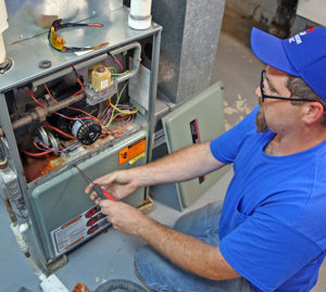 should I repair or replace my heating system in Waterford WI